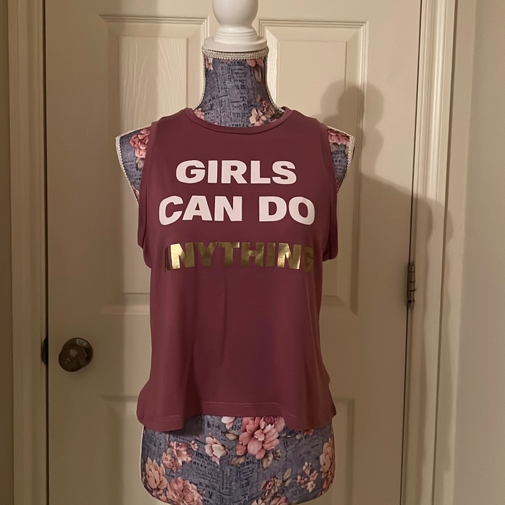 Dark rosé colored activewear tank.  Says “Girls Can Do Anything.” Size medium.